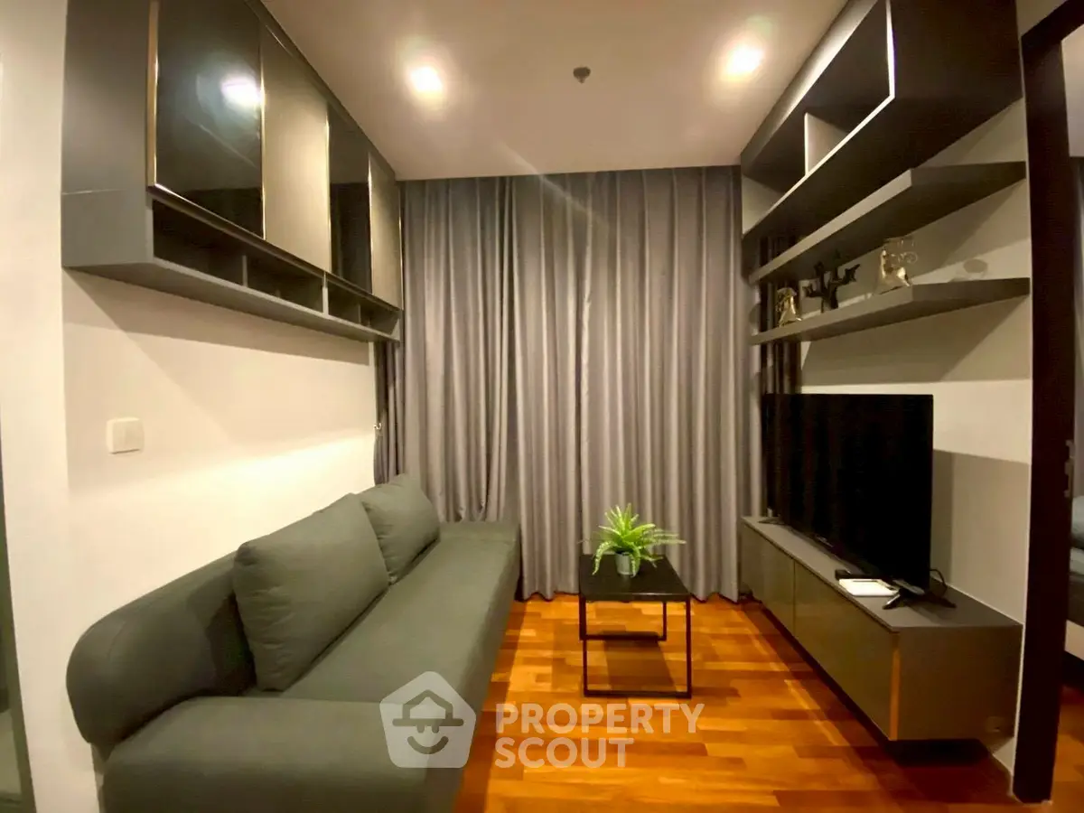 Modern living room with sleek furniture and stylish shelving, perfect for urban living.