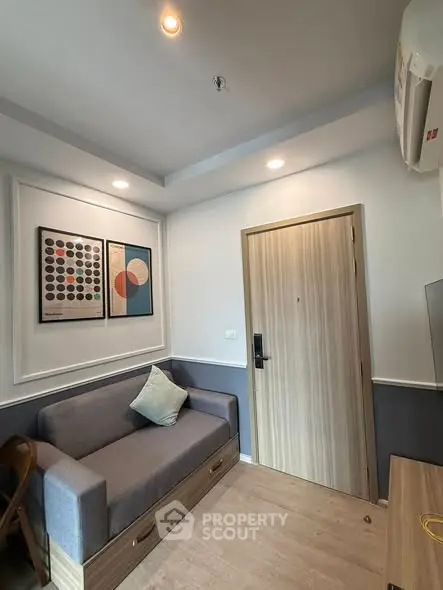 Modern living room with stylish decor and cozy seating in a contemporary apartment.