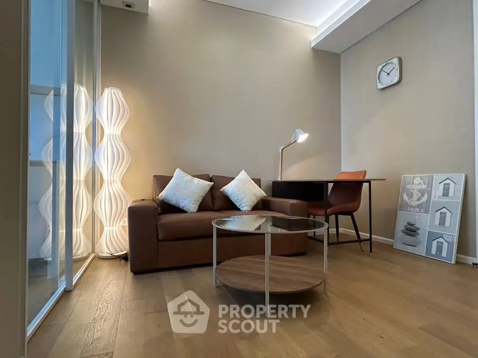 Modern living room with stylish furniture and elegant lighting, perfect for cozy evenings.