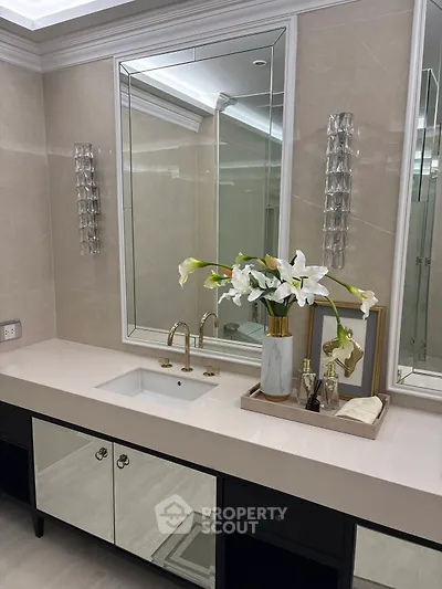 Luxurious bathroom with elegant vanity and floral decor