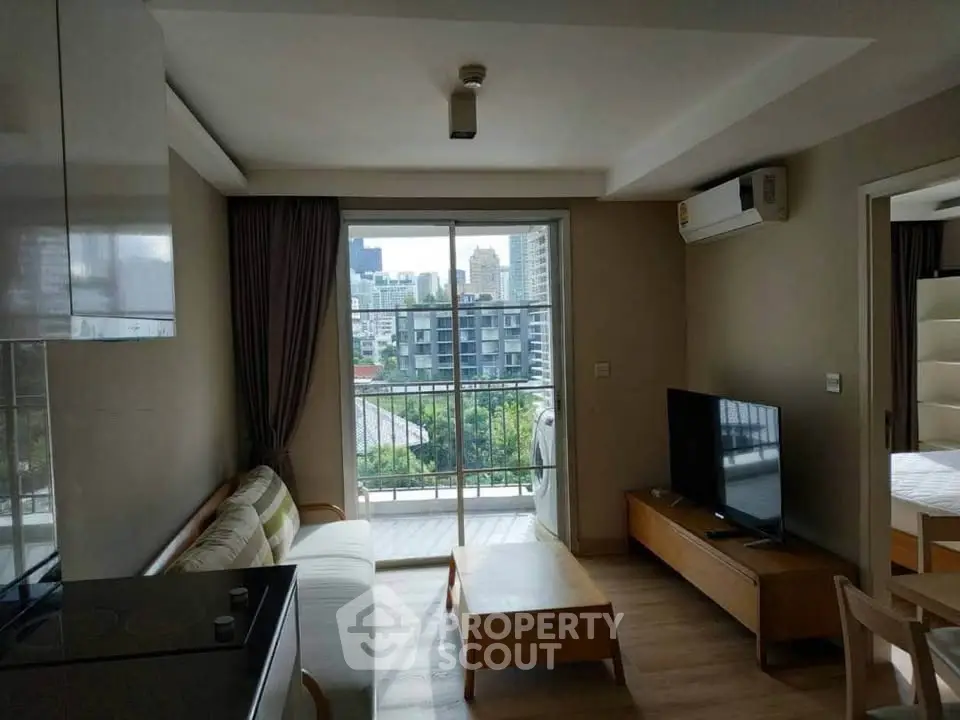 Modern living room with balcony view in urban apartment