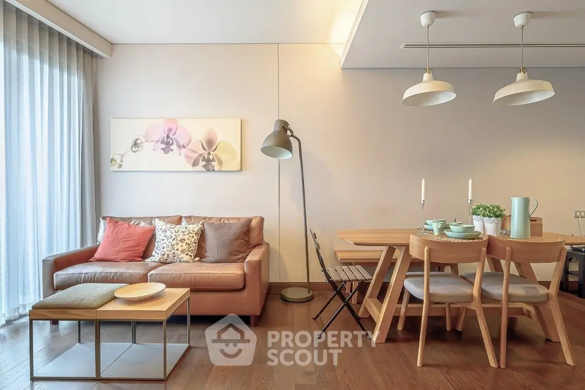 Stylish living room with modern furniture and elegant dining area, perfect for cozy gatherings.