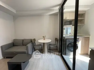 Modern compact living room with kitchenette and washing machine