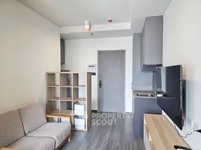 Modern studio apartment with sleek design and compact kitchen