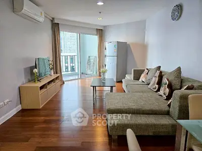 Spacious modern living room with balcony and stylish decor