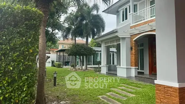 Charming suburban home with lush garden and modern architecture.