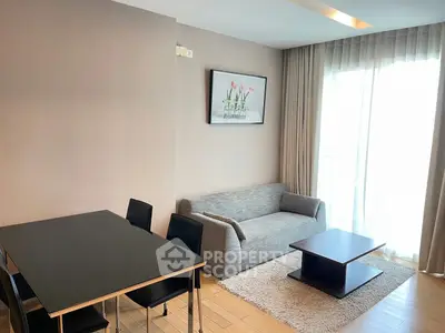 Modern living room with sleek furniture and natural light, perfect for urban living.