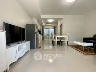 Spacious modern living room with open layout and sleek furnishings, perfect for contemporary living.