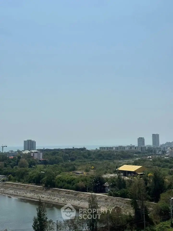 Stunning panoramic view of cityscape and ocean from high-rise building