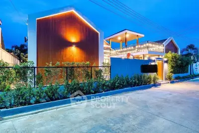 Modern luxury home exterior with stunning architectural design and ambient lighting.