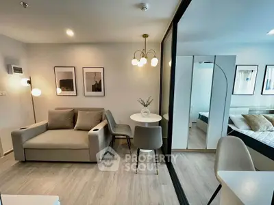 Modern living room with stylish decor and cozy seating area in a contemporary apartment.