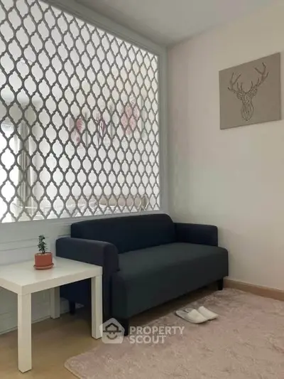 Cozy living room with stylish sofa and decorative wall art