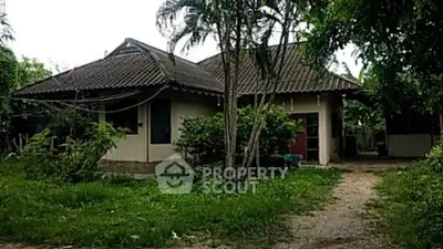 Charming rustic house surrounded by lush greenery, perfect for nature lovers seeking tranquility.