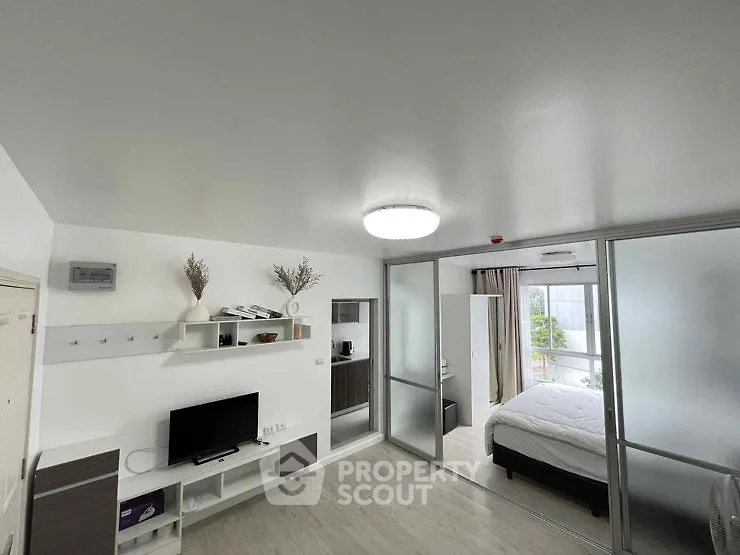 Modern studio apartment with sleek design and natural light