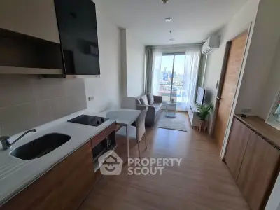 Modern open-layout kitchen and living room with city view