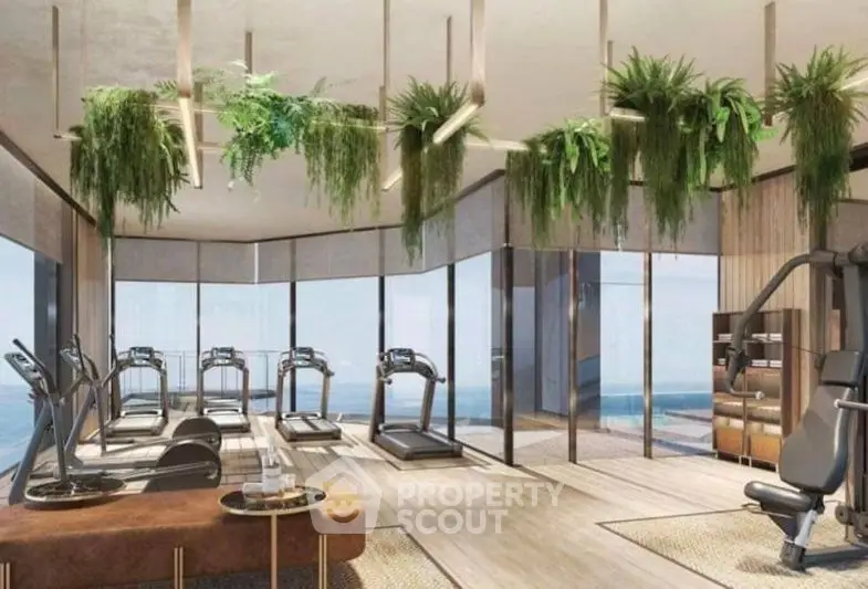 Luxurious gym with panoramic ocean views and modern fitness equipment.