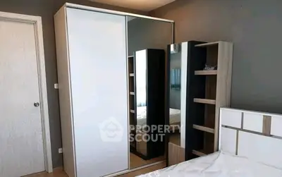 Modern bedroom with sleek wardrobe and stylish bed frame