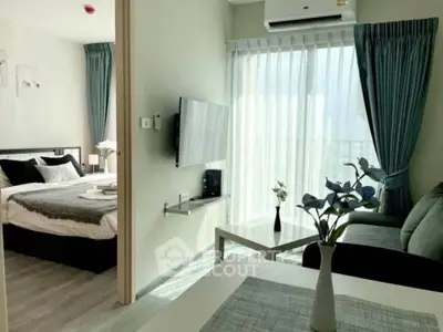 Modern apartment interior with cozy living room and bedroom, featuring stylish decor and natural light.