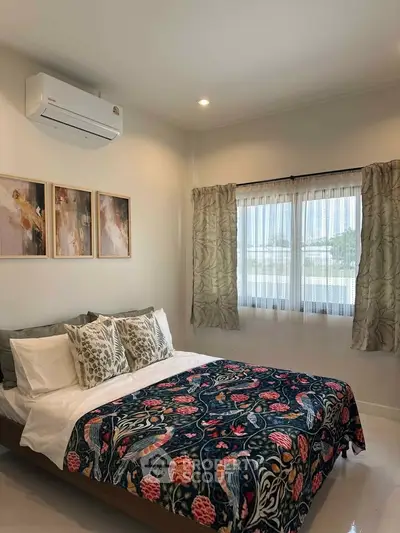 Cozy bedroom with stylish decor and natural light