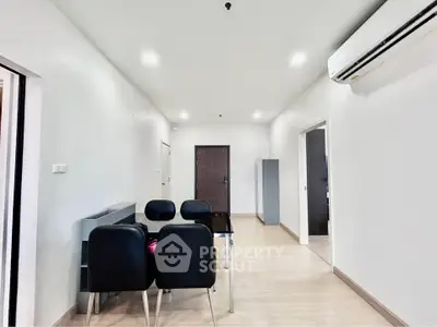 Modern apartment interior with sleek dining area and air conditioning