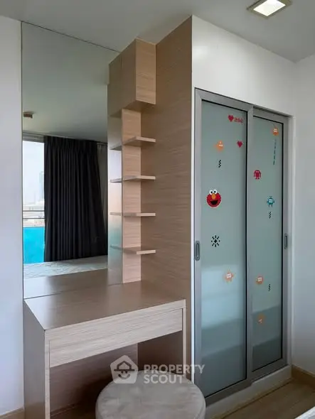 Modern bedroom with stylish sliding closet doors and built-in vanity desk.