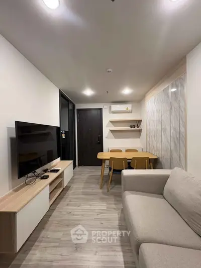 Modern living room with sleek furniture and stylish decor in a contemporary apartment.