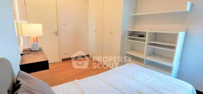 Cozy bedroom with built-in wardrobe and modern decor