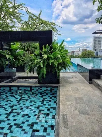 Luxurious rooftop pool with stunning city views and lush greenery