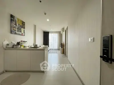 Modern open-layout kitchen with sleek design and natural light