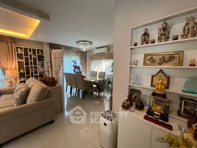 Elegant living and dining area with modern decor and ample natural light