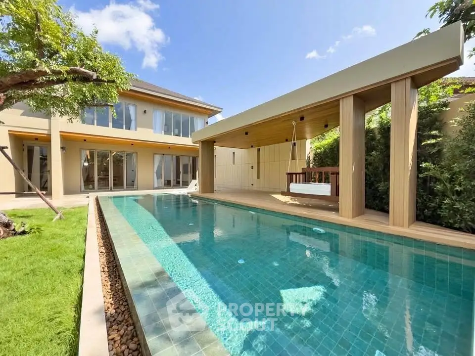 Luxurious modern home with private pool and spacious outdoor area, perfect for relaxation and entertainment.