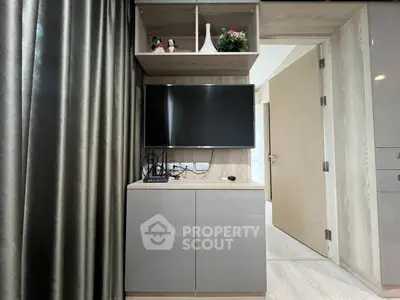 Modern living room with sleek TV unit and elegant decor
