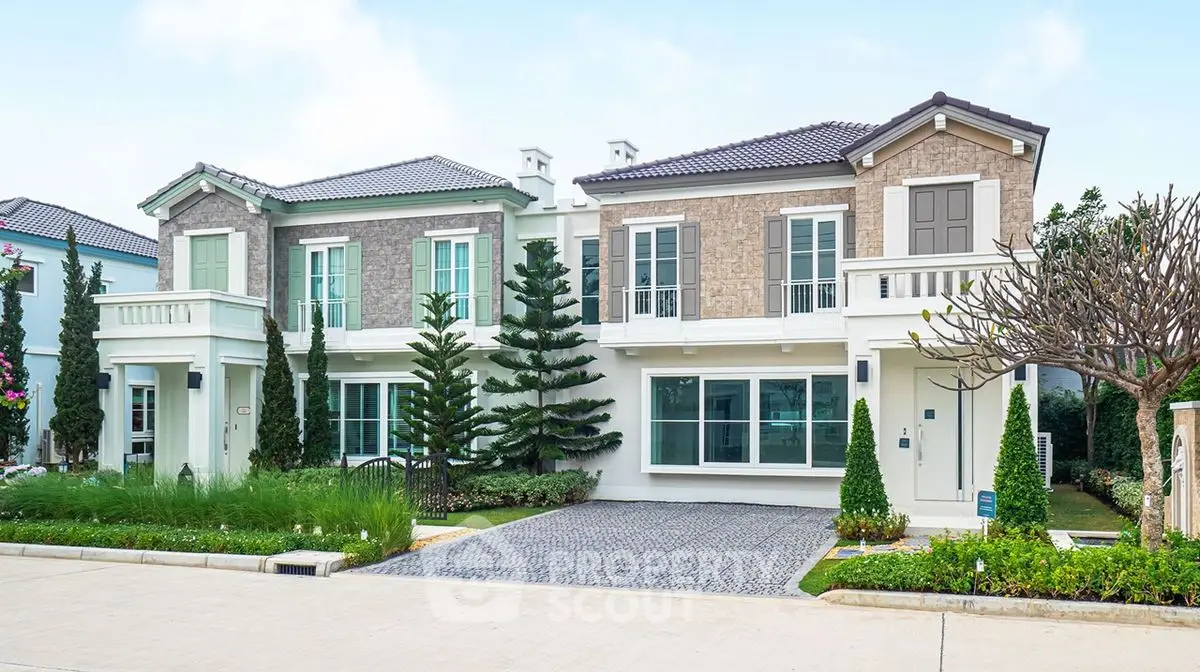 Elegant suburban house with manicured garden and spacious driveway