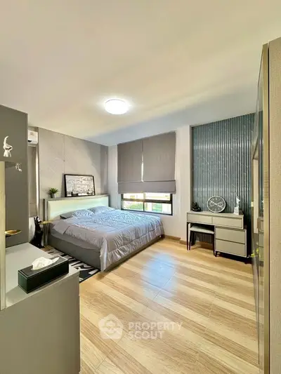 Modern bedroom with stylish decor and ample natural light