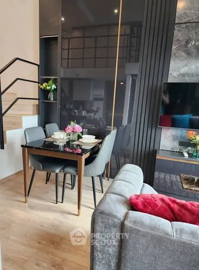 Modern living room with stylish dining area and sleek decor