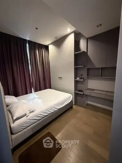 Cozy bedroom with modern design and ample natural light