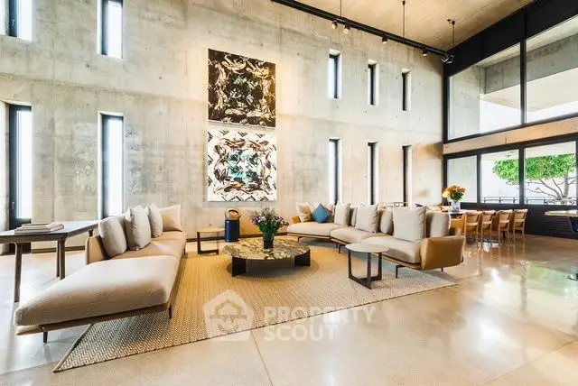 Luxurious modern living room with high ceilings and elegant decor