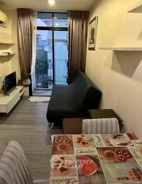 Cozy living room with modern decor and balcony view