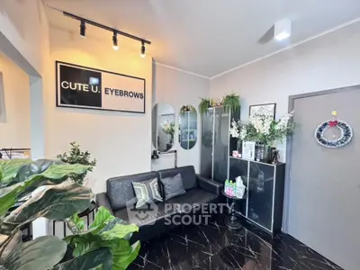 Chic modern interior with stylish black sofa and elegant decor