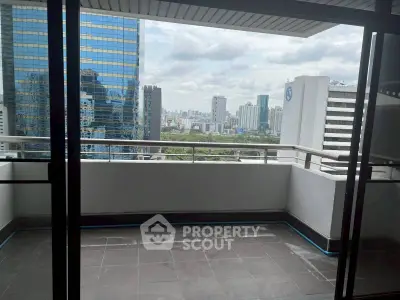 Spacious balcony with stunning city skyline view, perfect for urban living.