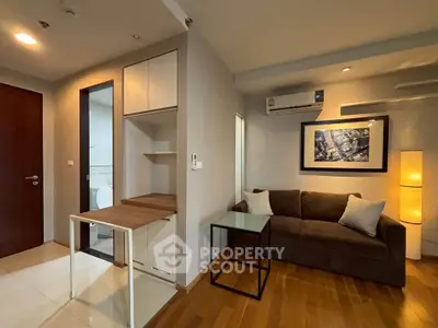 Modern living room with cozy sofa and stylish decor in a contemporary apartment.