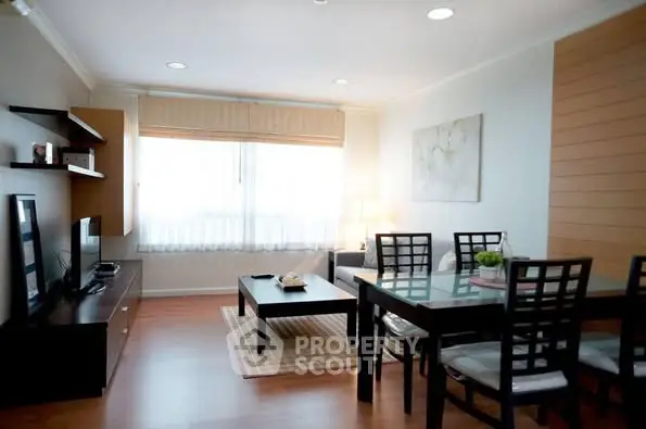 Elegant living room with modern furniture and natural light, perfect for relaxation and entertainment.