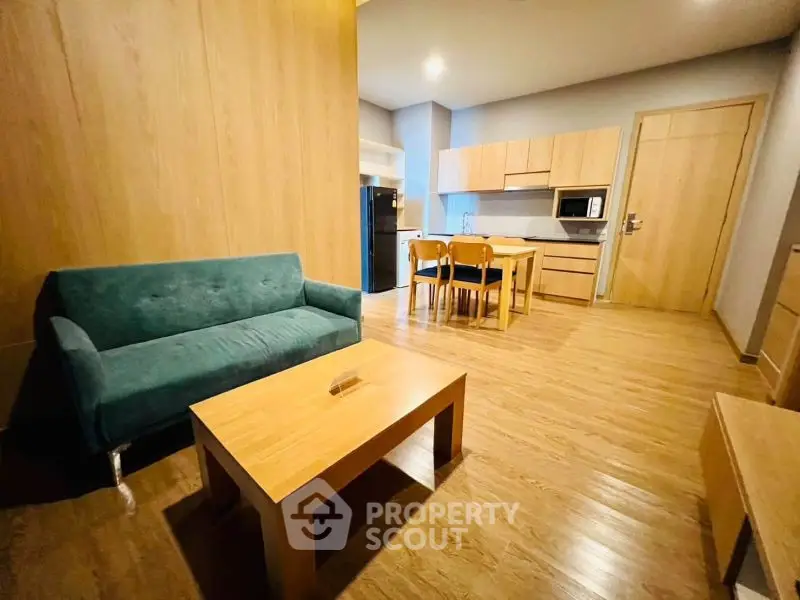 Spacious living room with modern furniture and open kitchen layout