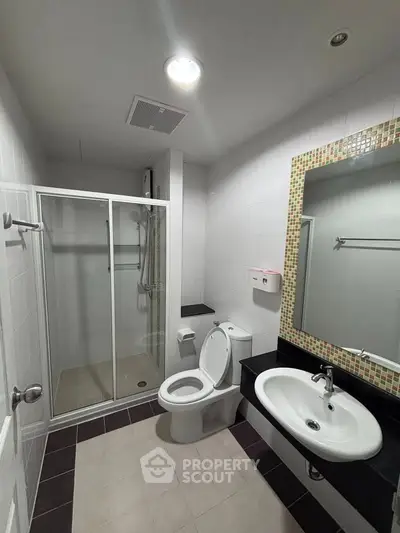 Modern bathroom with glass shower and stylish sink area