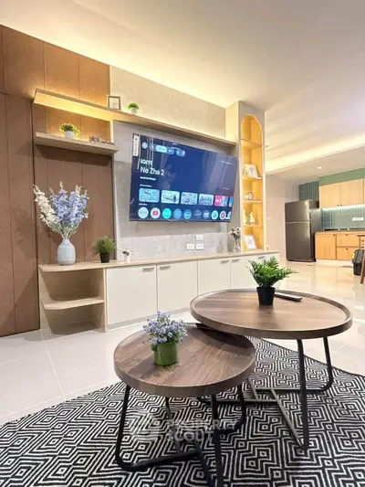 Modern living room with stylish furniture and open kitchen layout