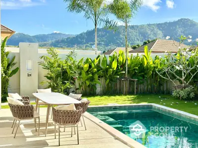 Luxurious outdoor pool area with stunning mountain views and lush greenery