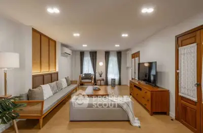 Spacious living room with modern decor and natural light