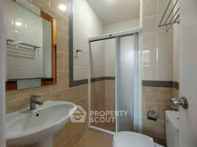 Modern bathroom with sleek shower and elegant tile design