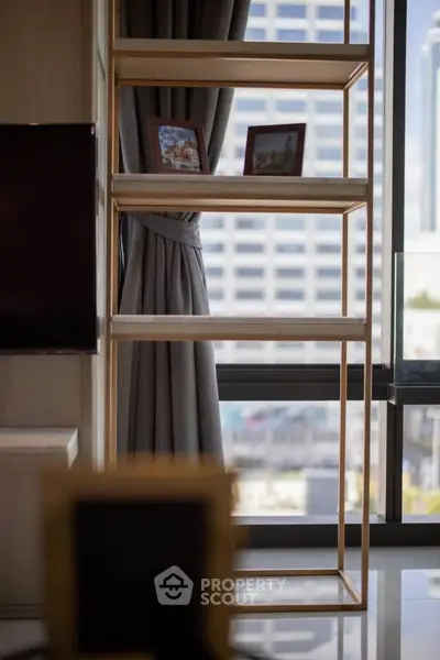 Modern interior with stylish shelving and city view through large windows