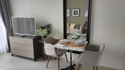 Modern living room with stylish dining area and TV setup